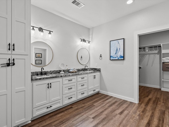 bathroom featuring vanity and hardwood / wood-style floors