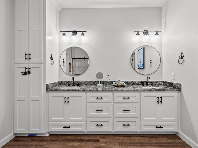 bathroom featuring vanity and hardwood / wood-style flooring