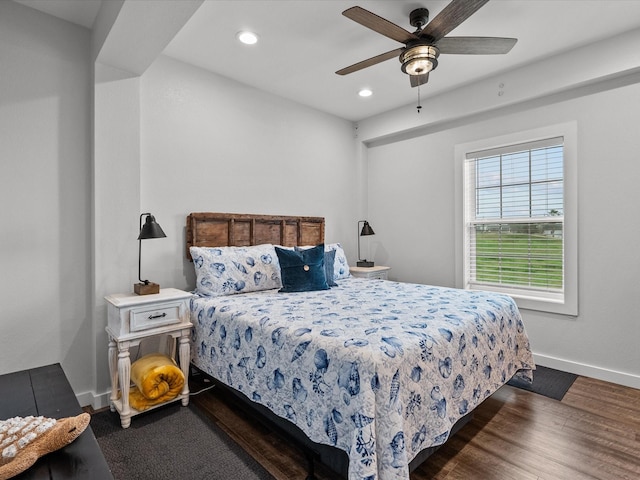 bedroom featuring ceiling fan and dark hardwood / wood-style flooring