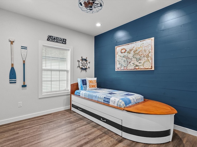 bedroom with hardwood / wood-style floors