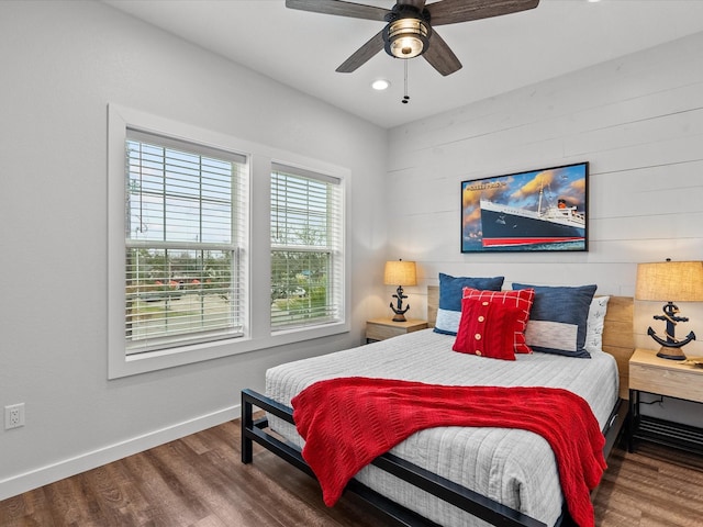 bedroom featuring dark wood-type flooring and ceiling fan