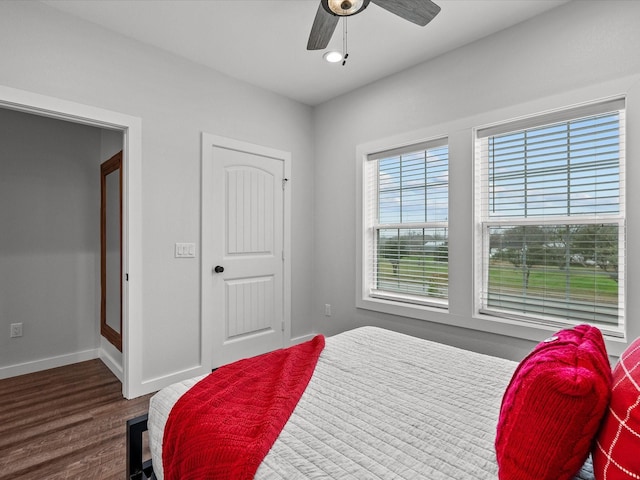 bedroom featuring dark wood-type flooring and ceiling fan