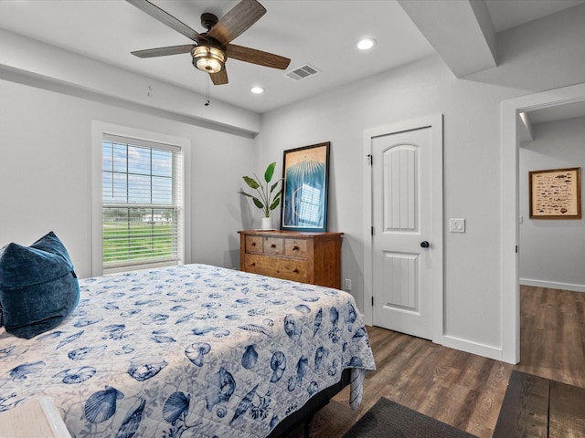 bedroom featuring dark hardwood / wood-style floors and ceiling fan