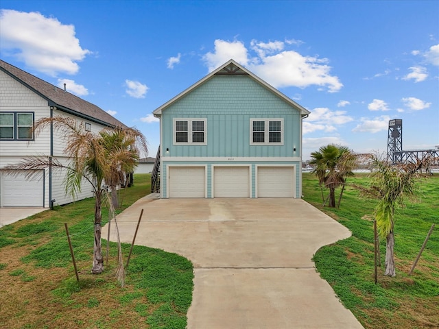 view of front of property with a garage and a front yard