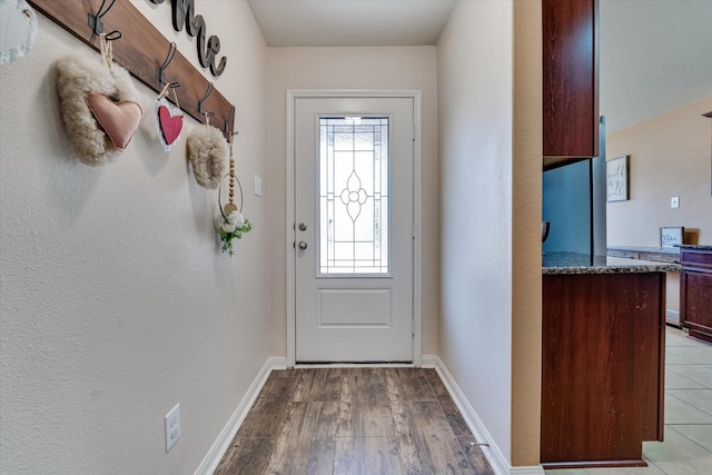 doorway to outside with light hardwood / wood-style flooring