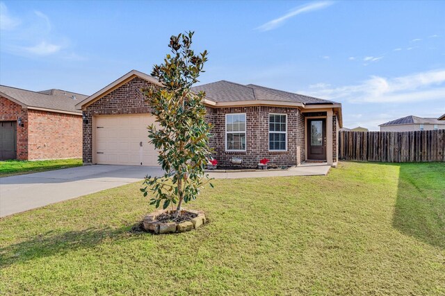 ranch-style house featuring a garage and a front lawn