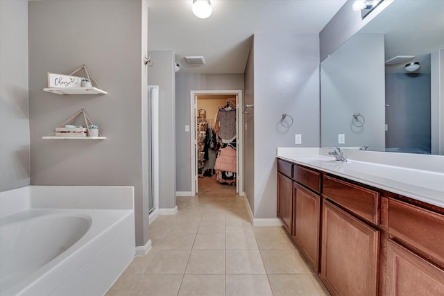 bathroom with tile patterned flooring, vanity, and independent shower and bath