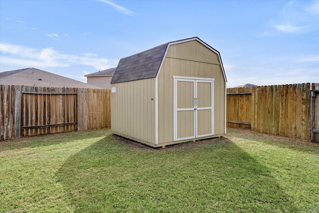 view of outdoor structure with a lawn