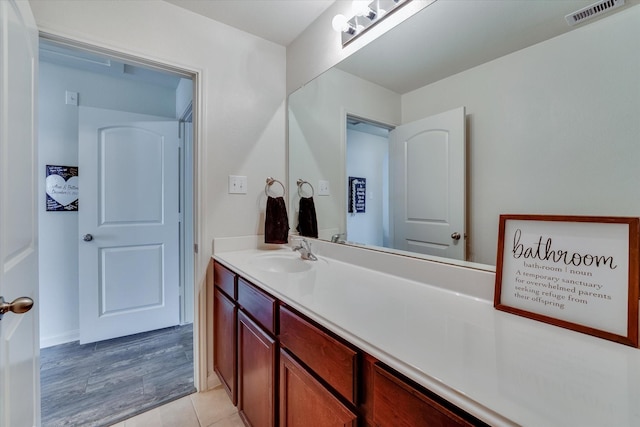 bathroom with vanity and tile patterned floors