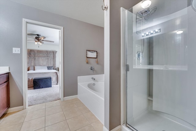 bathroom with vanity, tile patterned floors, shower with separate bathtub, and ceiling fan