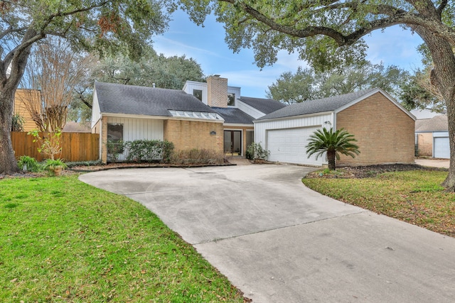 ranch-style home with a garage and a front yard