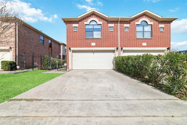 view of front of home featuring a garage and a front yard