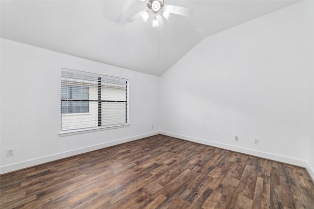 unfurnished room with dark hardwood / wood-style flooring, vaulted ceiling, and ceiling fan