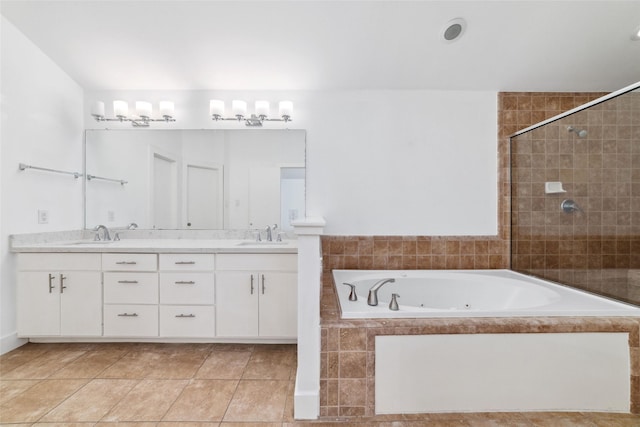 bathroom with vanity, tile patterned floors, and shower with separate bathtub