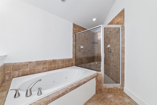 bathroom featuring tile patterned floors and independent shower and bath