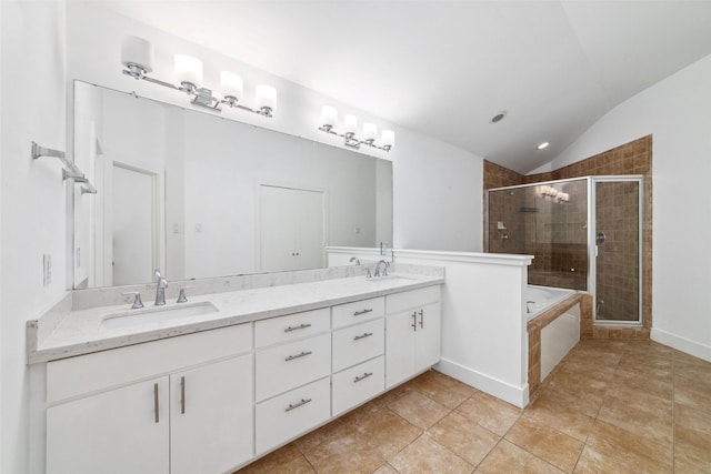 bathroom featuring lofted ceiling, vanity, tile patterned floors, and separate shower and tub