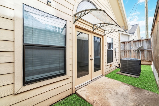 view of patio / terrace featuring cooling unit and french doors