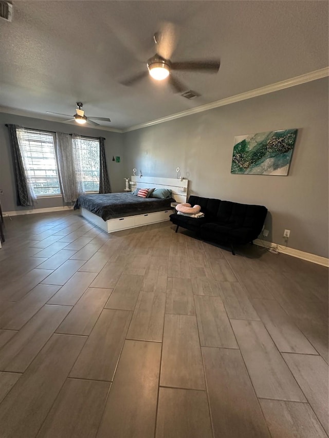 1723 Park Ridge Dr, Katy, TX 77450 - bedroom with ornamental molding, wood finished floors, a ceiling fan, baseboards, and a textured ceiling