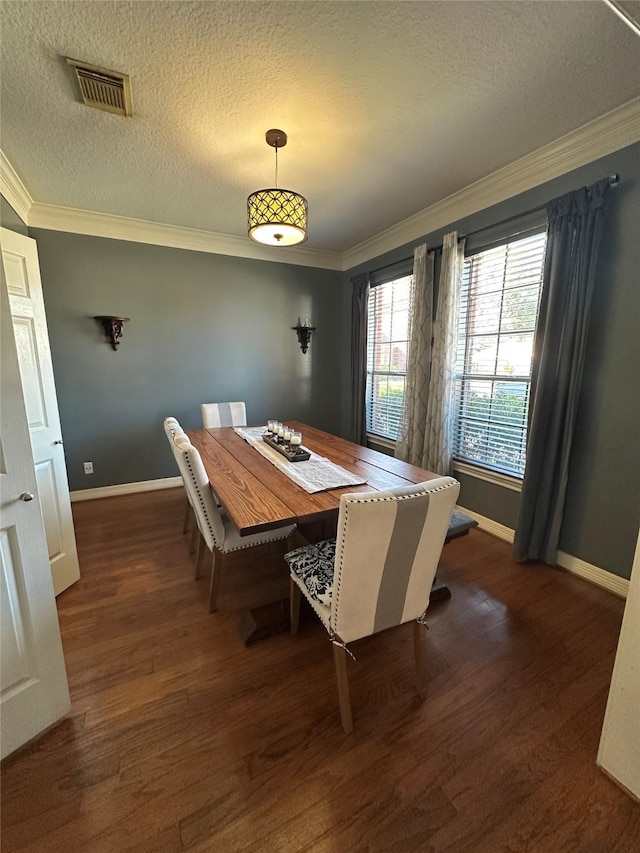 1723 Park Ridge Dr, Katy, TX 77450 - dining space featuring ornamental molding, a textured ceiling, dark wood-style flooring, and baseboards