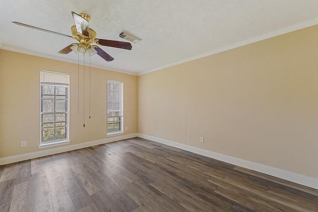 spare room featuring ceiling fan, crown molding, dark hardwood / wood-style floors, and a textured ceiling