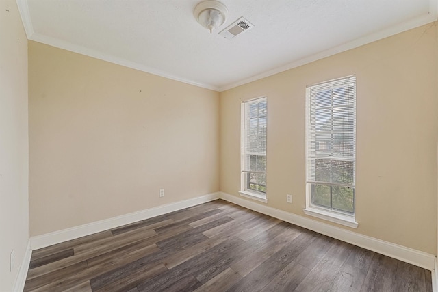 unfurnished room featuring crown molding and dark wood-type flooring