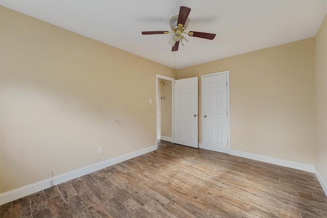 unfurnished bedroom with hardwood / wood-style flooring and ceiling fan