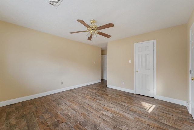 spare room featuring hardwood / wood-style floors and ceiling fan