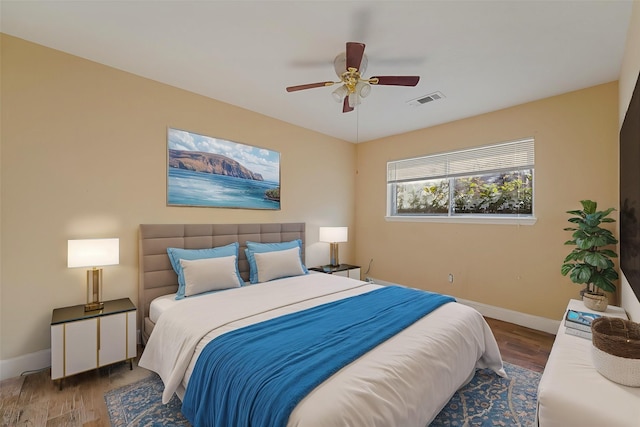 bedroom with wood-type flooring and ceiling fan