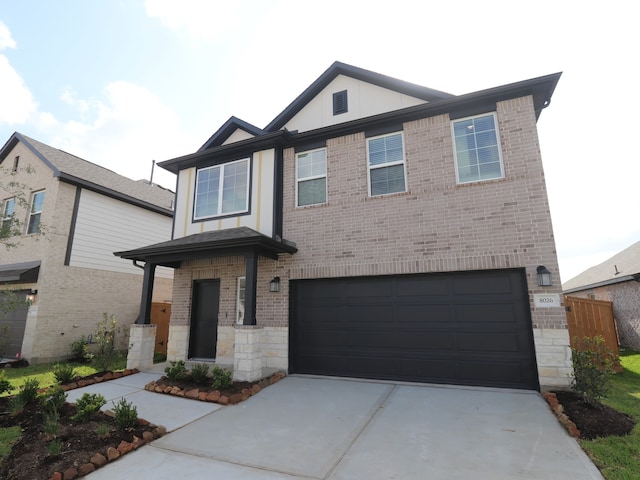 8026 Kay Harbor Dr, Cypress, TX 77433 - view of front of home featuring brick siding, concrete driveway, an attached garage, stone siding, and board and batten siding