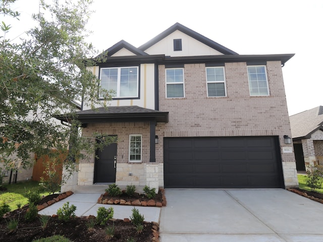 8026 Kay Harbor Dr, Cypress, TX 77433 - view of front facade featuring driveway, an attached garage, brick siding, and stone siding