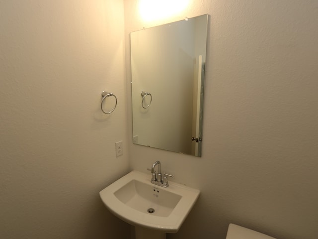 8026 Kay Harbor Dr, Cypress, TX 77433 - bathroom featuring a sink and toilet