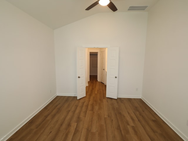 8026 Kay Harbor Dr, Cypress, TX 77433 - empty room featuring vaulted ceiling, a ceiling fan, dark wood-style flooring, and baseboards