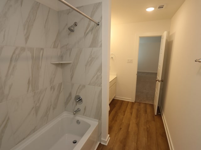 8026 Kay Harbor Dr, Cypress, TX 77433 - full bath with shower / tub combination, wood finished floors, vanity, baseboards, and recessed lighting