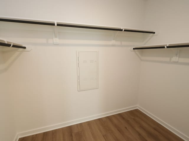 8026 Kay Harbor Dr, Cypress, TX 77433 - spacious closet featuring dark wood-type flooring