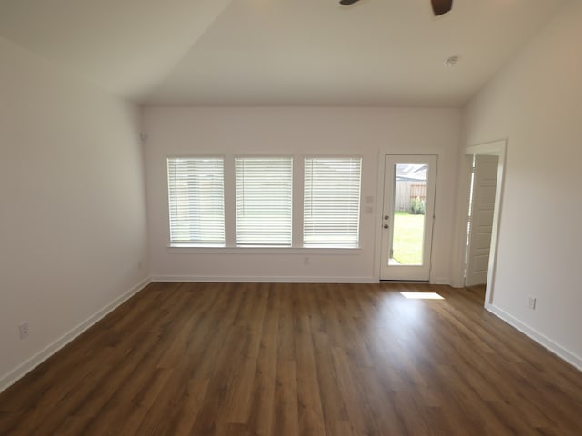 8026 Kay Harbor Dr, Cypress, TX 77433 - unfurnished living room with ceiling fan, dark wood-style floors, baseboards, and vaulted ceiling