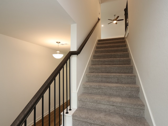 8026 Kay Harbor Dr, Cypress, TX 77433 - stairs featuring a ceiling fan and baseboards