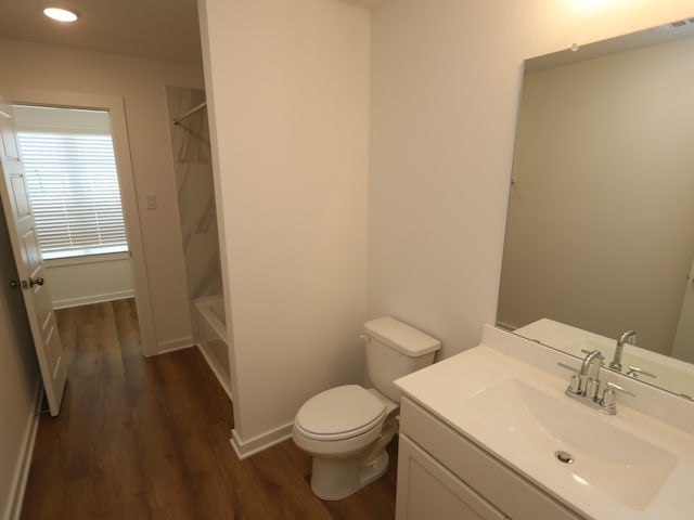 8026 Kay Harbor Dr, Cypress, TX 77433 - full bath with wood finished floors, vanity, toilet, shower / bathtub combination, and recessed lighting