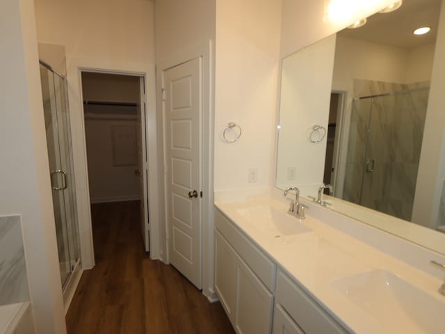 8026 Kay Harbor Dr, Cypress, TX 77433 - full bath with a stall shower, double vanity, and wood finished floors