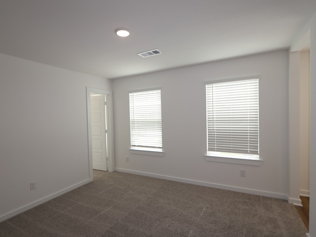 8026 Kay Harbor Dr, Cypress, TX 77433 - spare room featuring dark colored carpet and baseboards