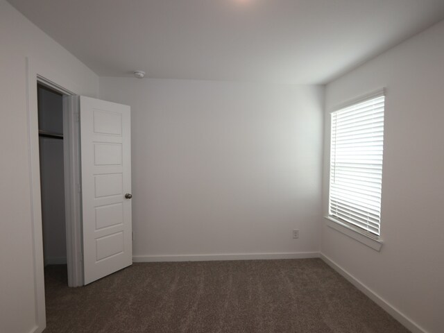 8026 Kay Harbor Dr, Cypress, TX 77433 - unfurnished bedroom featuring carpet flooring and baseboards
