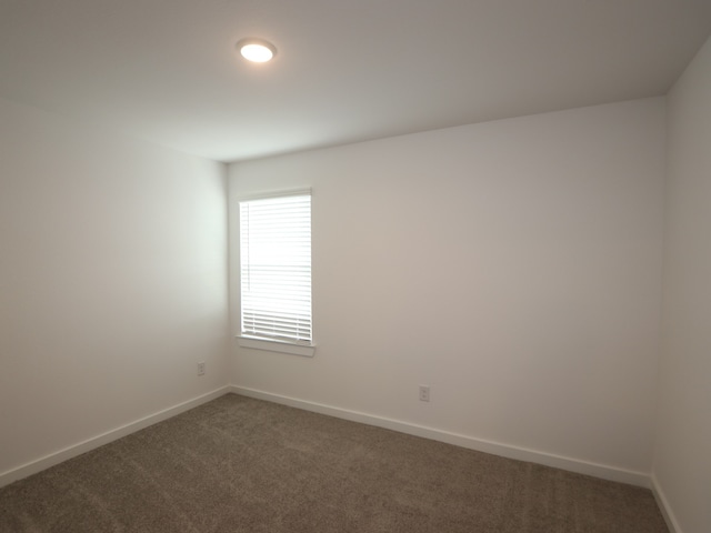 8026 Kay Harbor Dr, Cypress, TX 77433 - unfurnished room with dark colored carpet and baseboards