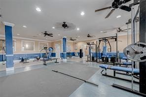 exercise room with ceiling fan