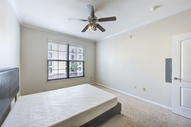 carpeted bedroom with ceiling fan, ornamental molding, and electric panel