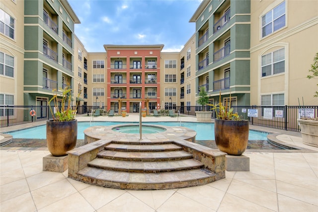 view of pool featuring a hot tub