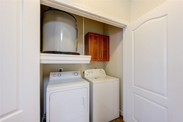 laundry room featuring cabinets and washing machine and clothes dryer