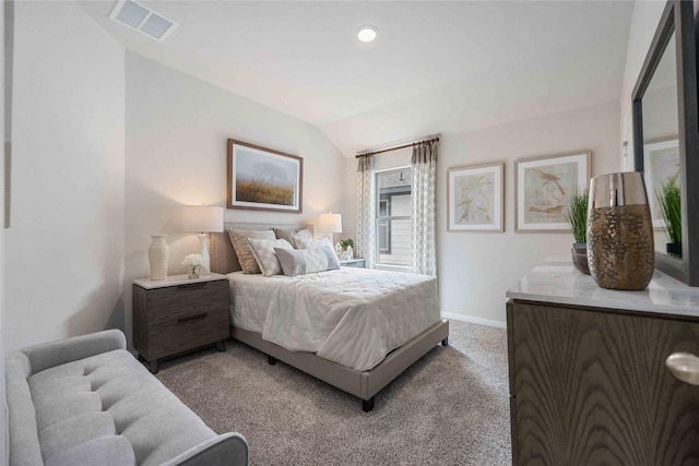 bedroom with vaulted ceiling and carpet