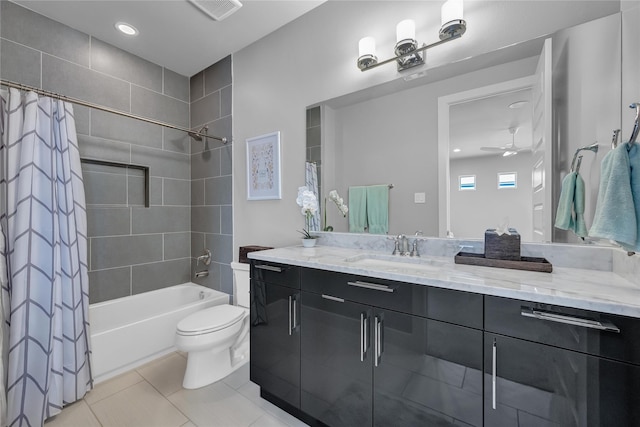 full bathroom with tile patterned floors, toilet, vanity, shower / bath combo with shower curtain, and ceiling fan