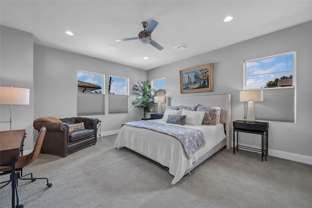 bedroom featuring light colored carpet and ceiling fan