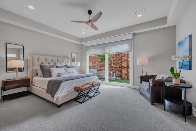 bedroom with ceiling fan, carpet flooring, and access to exterior