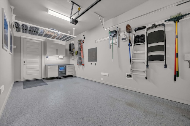 garage with a garage door opener and electric panel